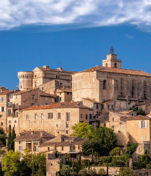 Famous old village Gordes in Provence against sunset in France
